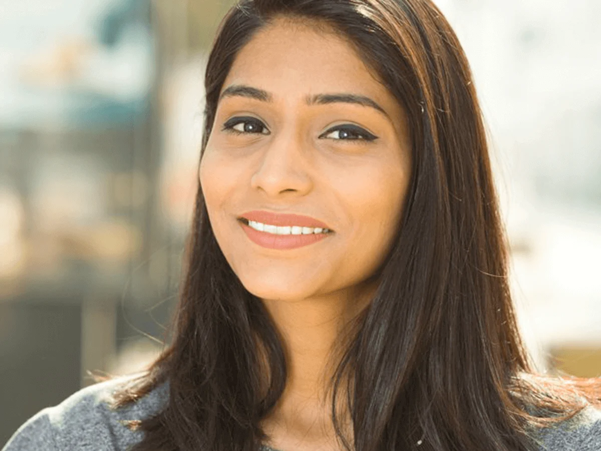 Smiling woman with clear braces treatment results